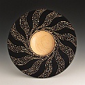 Carved Platter, Al Stirt Class, 8/2011  Maple Wood, Black Acrylic Gesso, Power Carved Pattern, 1.25" x 9.25"   Turned in Al Stirt class at Center for Furniture Craftsmenship in Rockport Maine, 8/2011 I did this bowl to experiement with the techniques Al demonstrated in his class.